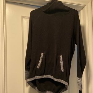 Long black sweatshirt with grey accents. Has front pocket, in good condition